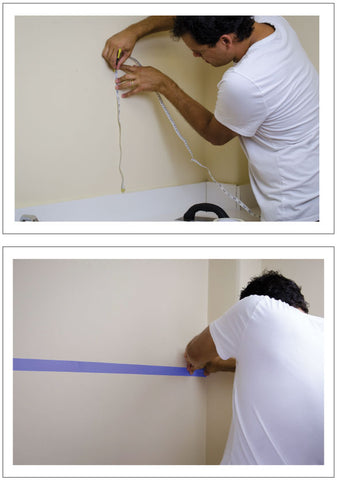 Measuring the wall before installing the backsplash tiles